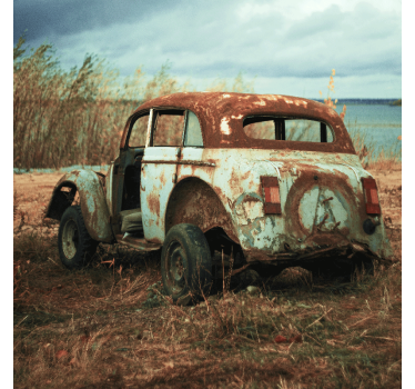 Living room poster of an old dirty car in the fields - TenStickers